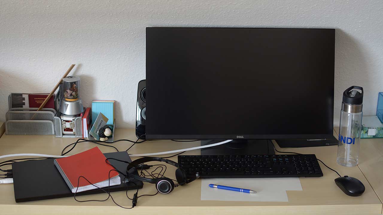 Desk with laptop, screen and keyboard, mobile office