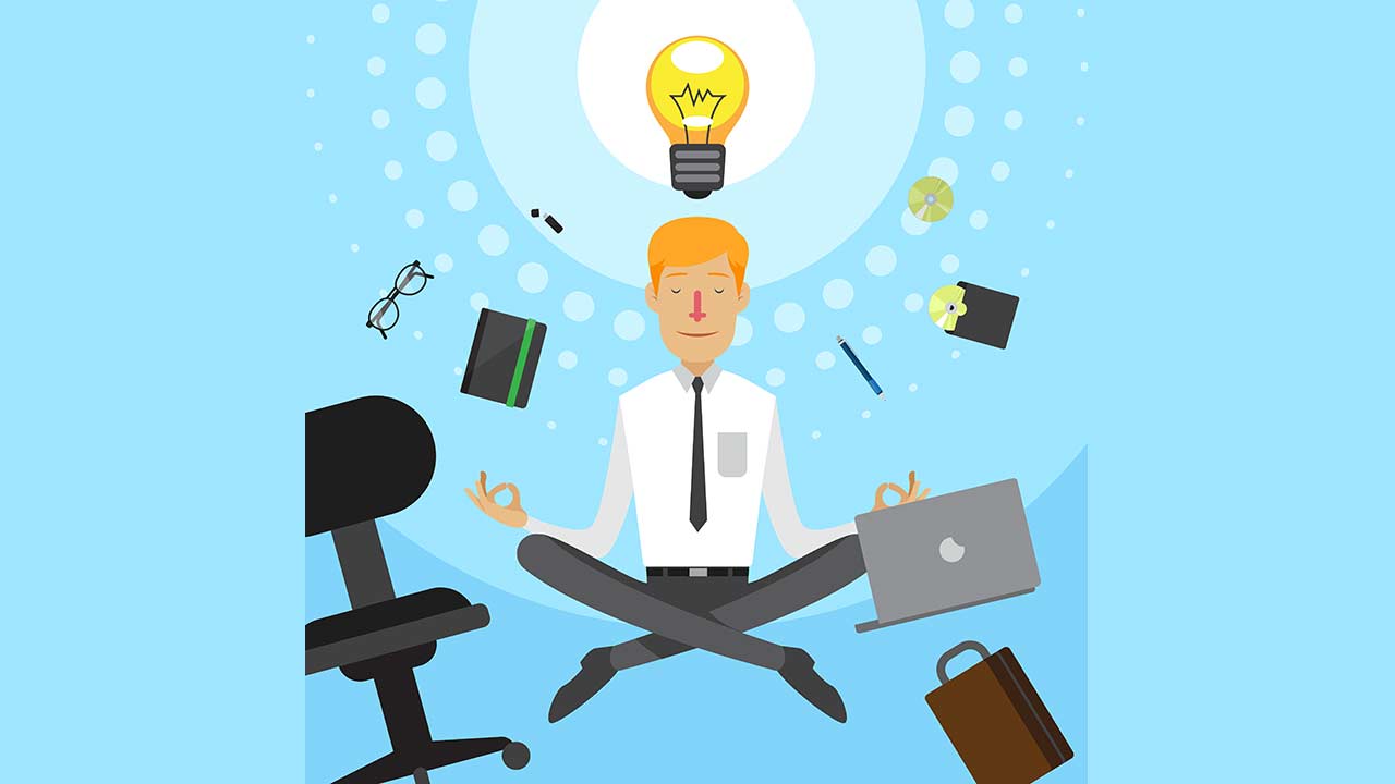 Man meditating, lamp above him, office supplies flying past him to the right and left
