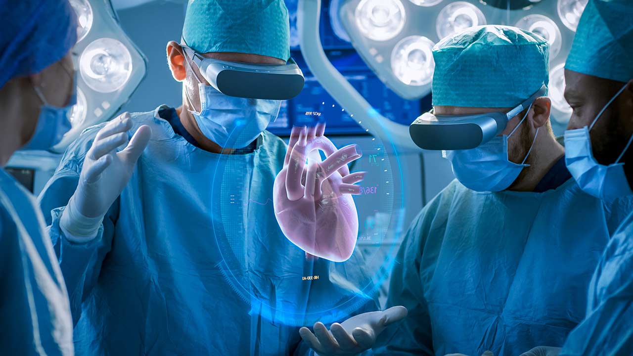 Four doctors at a heart surgery with reality glasses